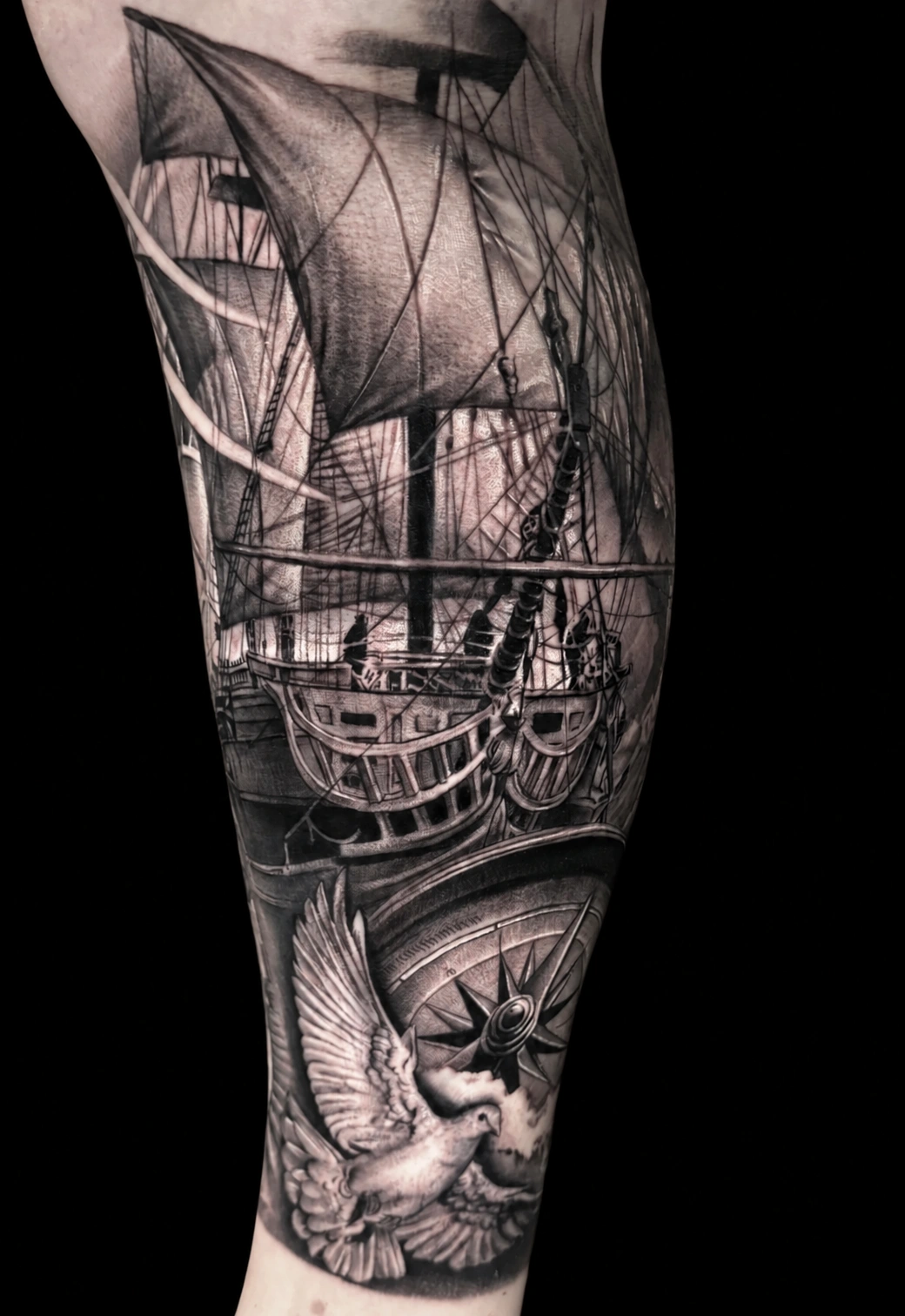Another view · Sailing ship, compass and dove